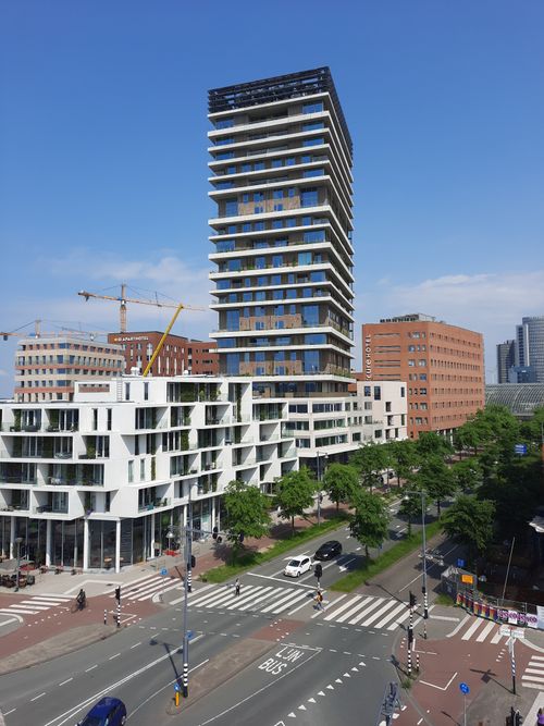 Free Aerial view of modern high-rise buildings and urban streets in Amsterdam, showcasing contemporary architecture. Stock Photo