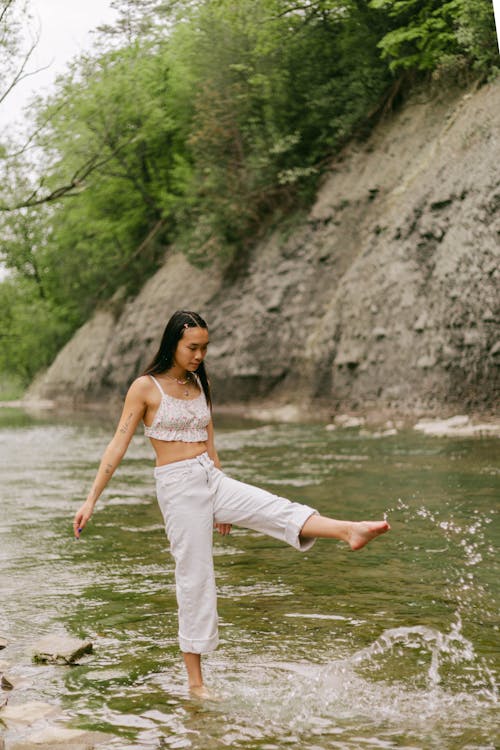 Woman Standing in a River