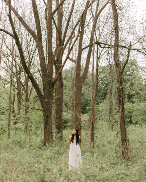 Woman Standing in the Forest