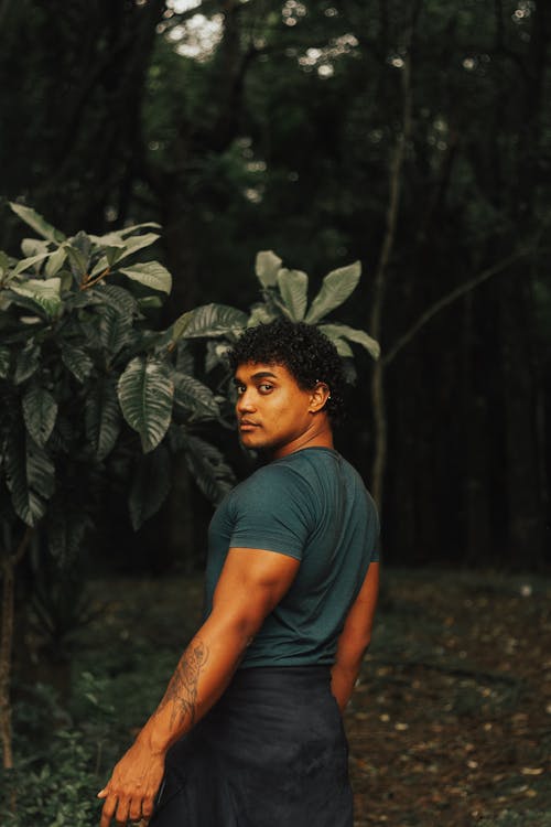 Young Man Posing in Tropical Forest