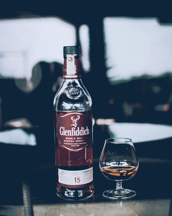 Glenfiddich Bottle Beside Wine Glass