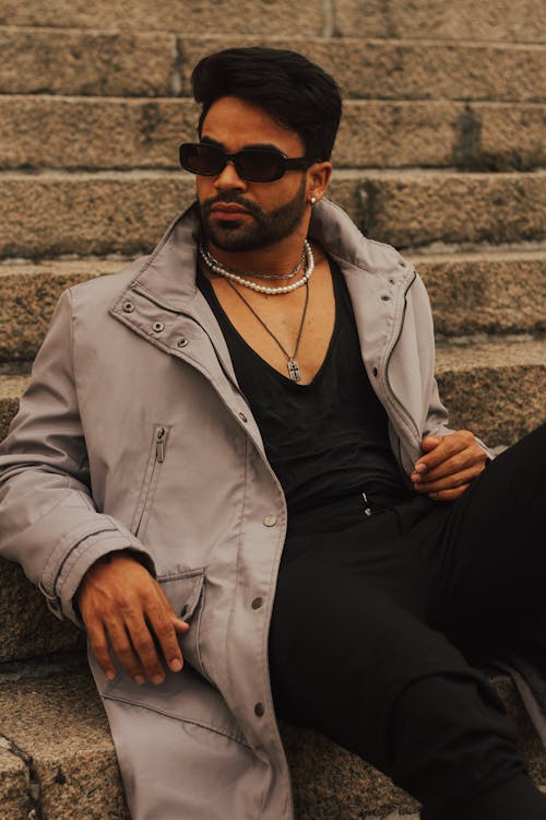 Man in Jacket Sitting and Posing
