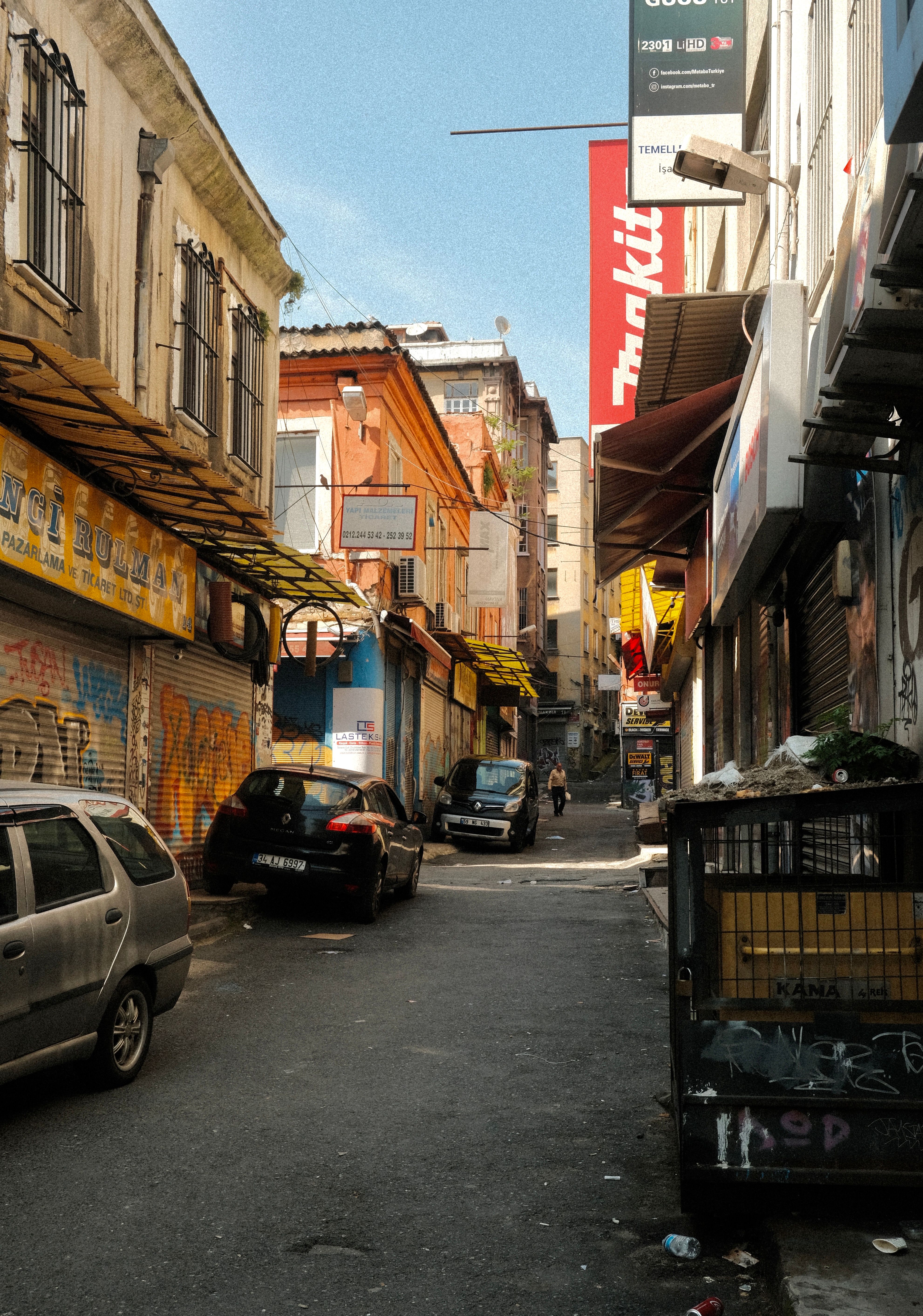 Cars Parked on Narrow Street · Free Stock Photo