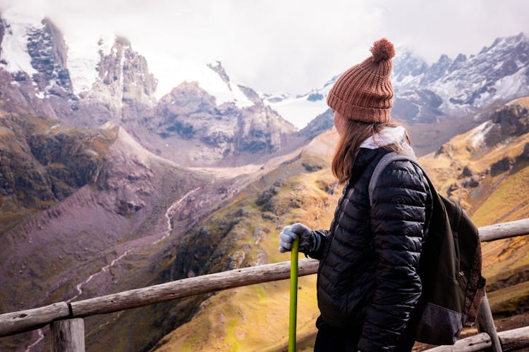 Woman Near Fence Hiking In Mountains 