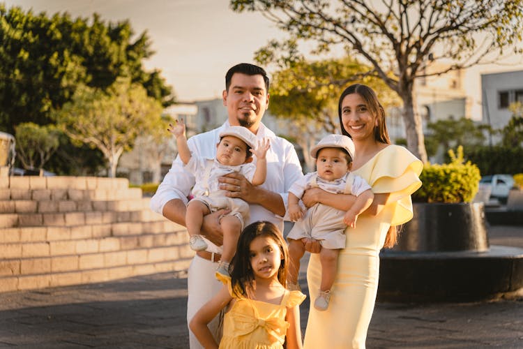 Mother And Father Posing With Children