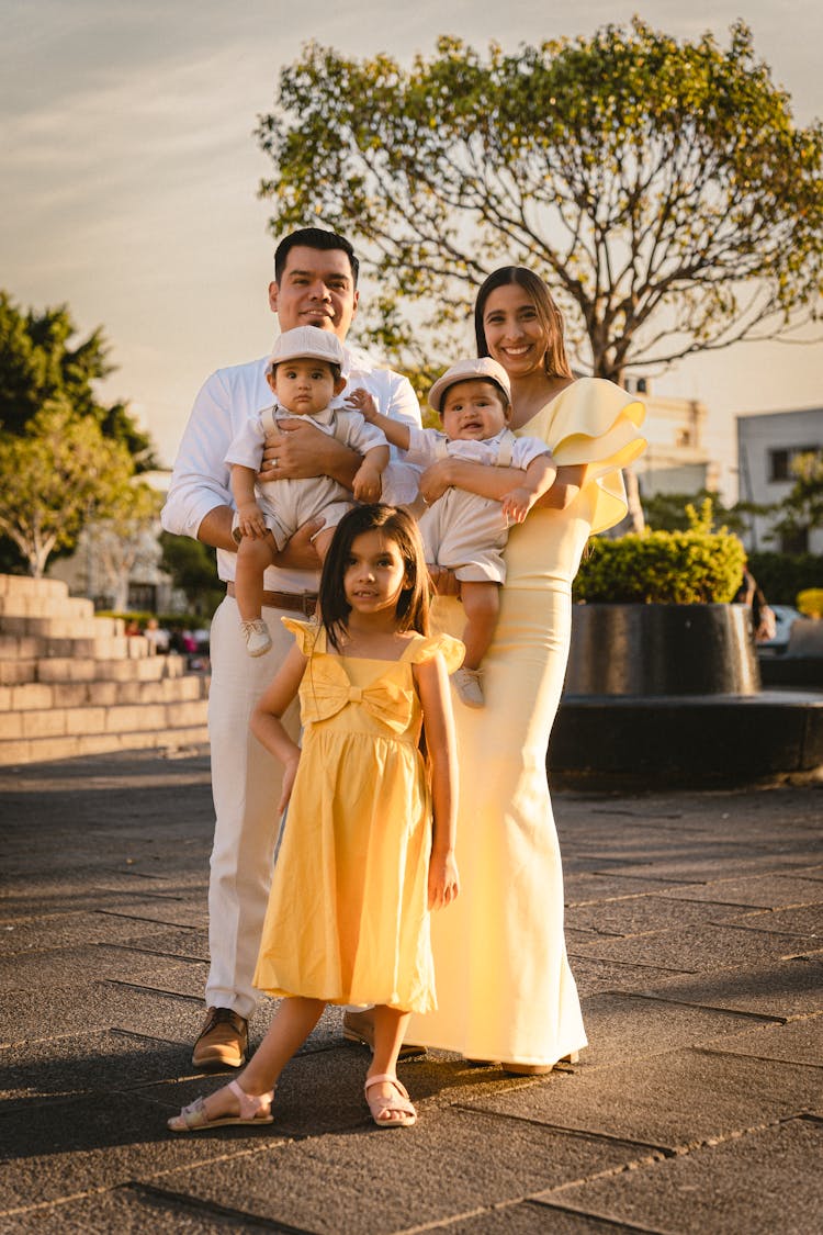 Mother And Father Posing With Children