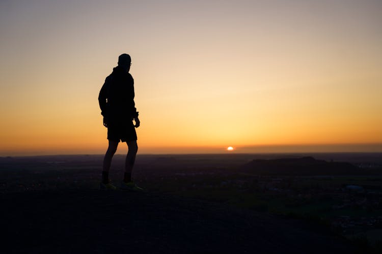 Man Looking On Sunrise