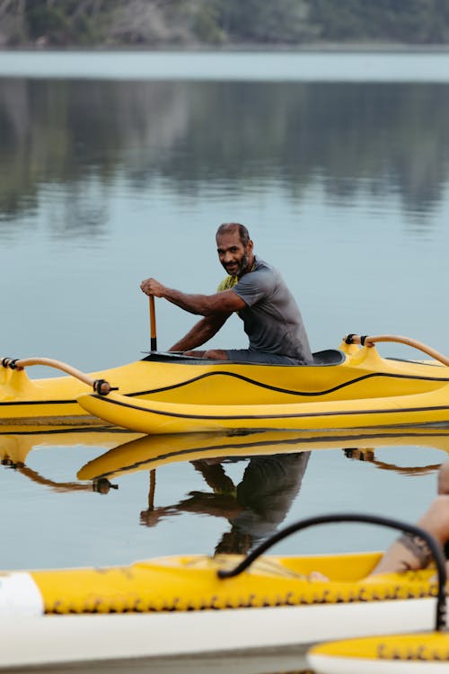 Man Kayaking on River