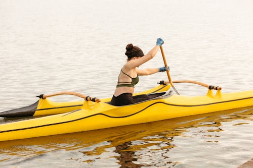 Woman Kayaking on the Lake 