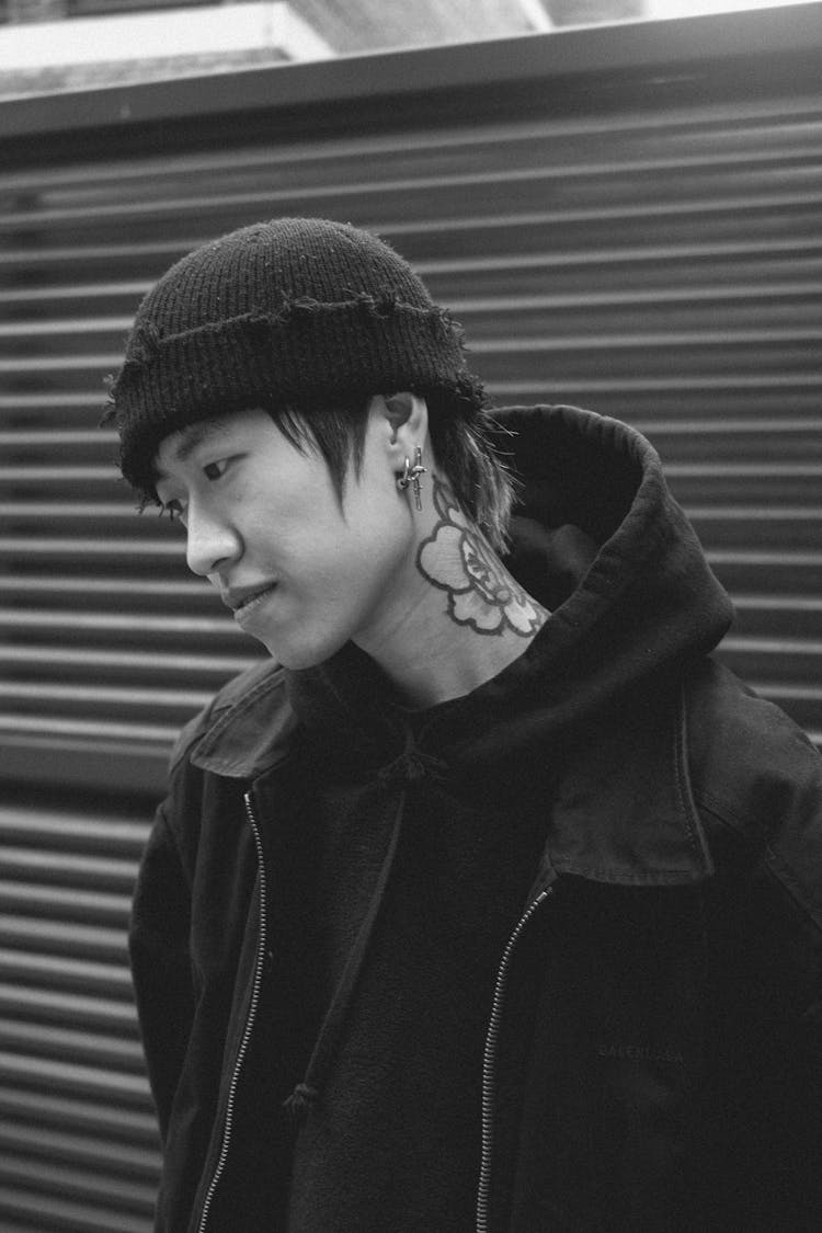 Man In Hat And With Tattoo In Black And White