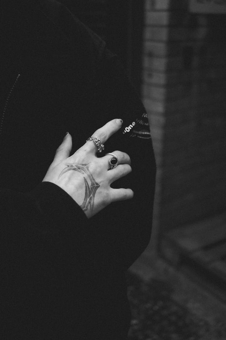 Hand With Tattoo And Rings