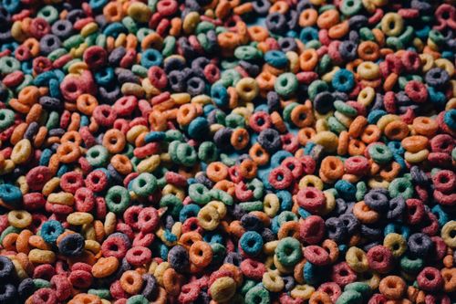 Free A vibrant close-up of multicolored cereal loops, capturing their playful texture and color. Stock Photo