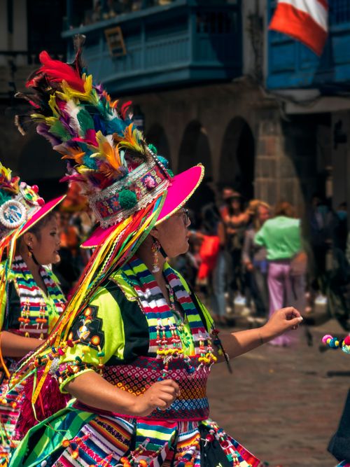 Free Capture of Peruvian dancers in colorful costumes during a street parade in Cusco. Stock Photo