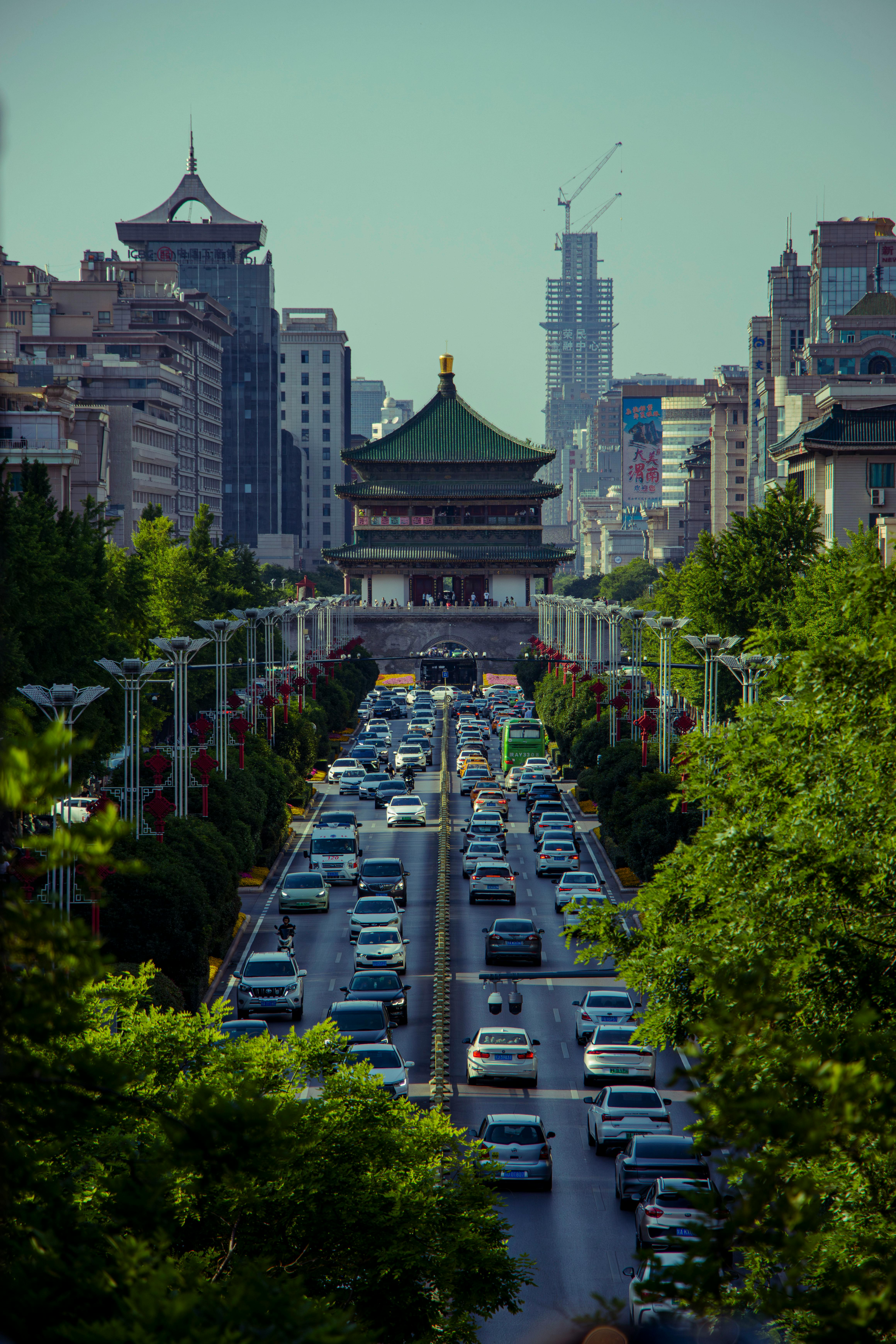 Aerial photo of Xi'an Bell Tower and busy street, capturing urban traffic and architecture.