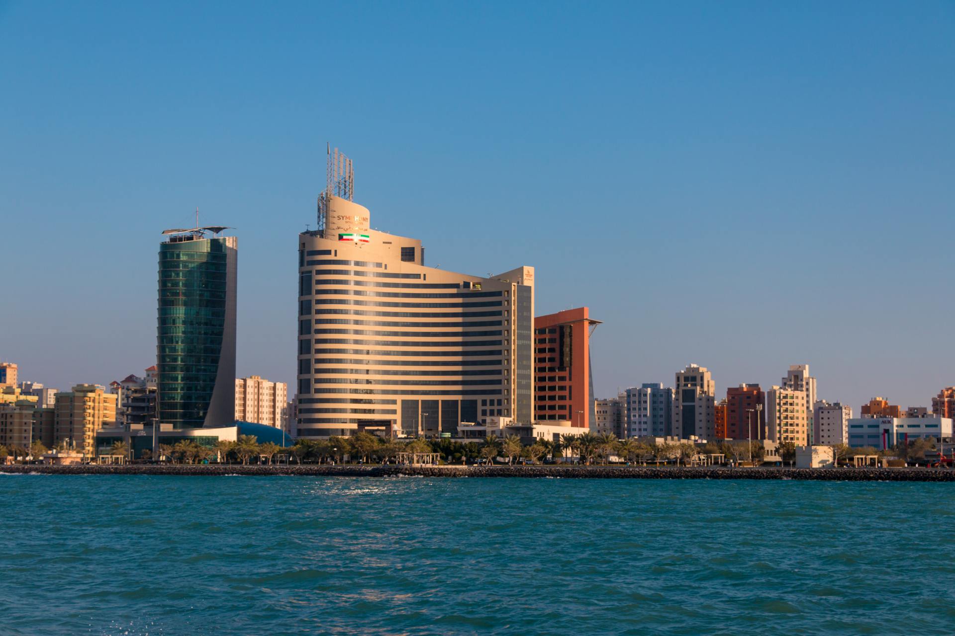 Stunning Kuwait City skyline featuring the Symphony Style Hotel by the coast.