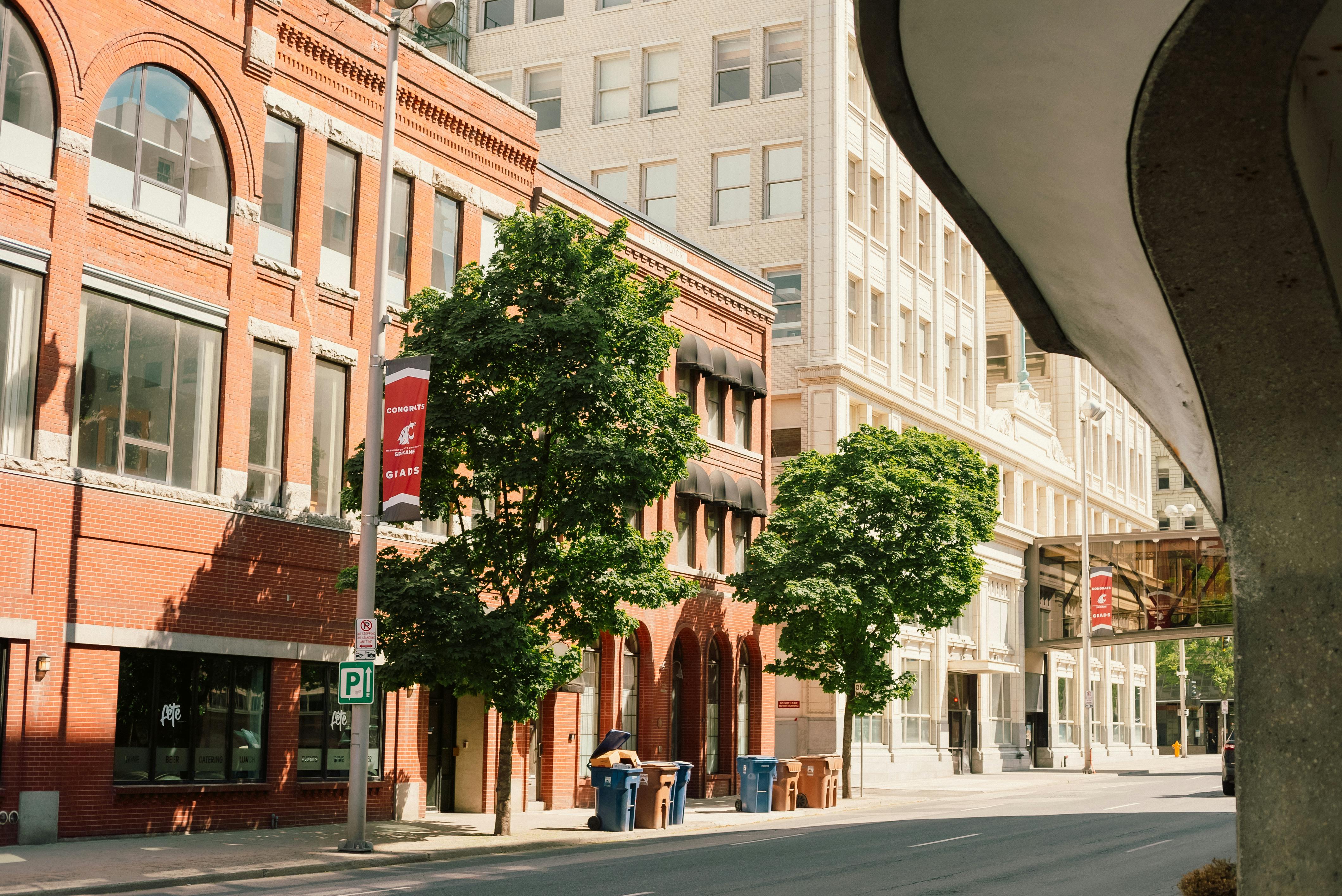 A vibrant street in downtown Spokane, WA showcasing historic architecture.