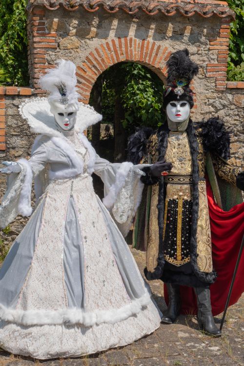 Free Two people dressed in ornate historical costumes posing in Clisson, France. Stock Photo