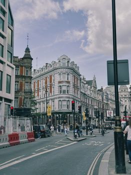 Street view of Shaftesbury Avenue in London, capturing urban life and iconic architecture.