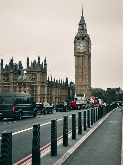 Free Iconic Big Ben and Westminster Palace seen from the bridge on an overcast day in London, England. Stock Photo