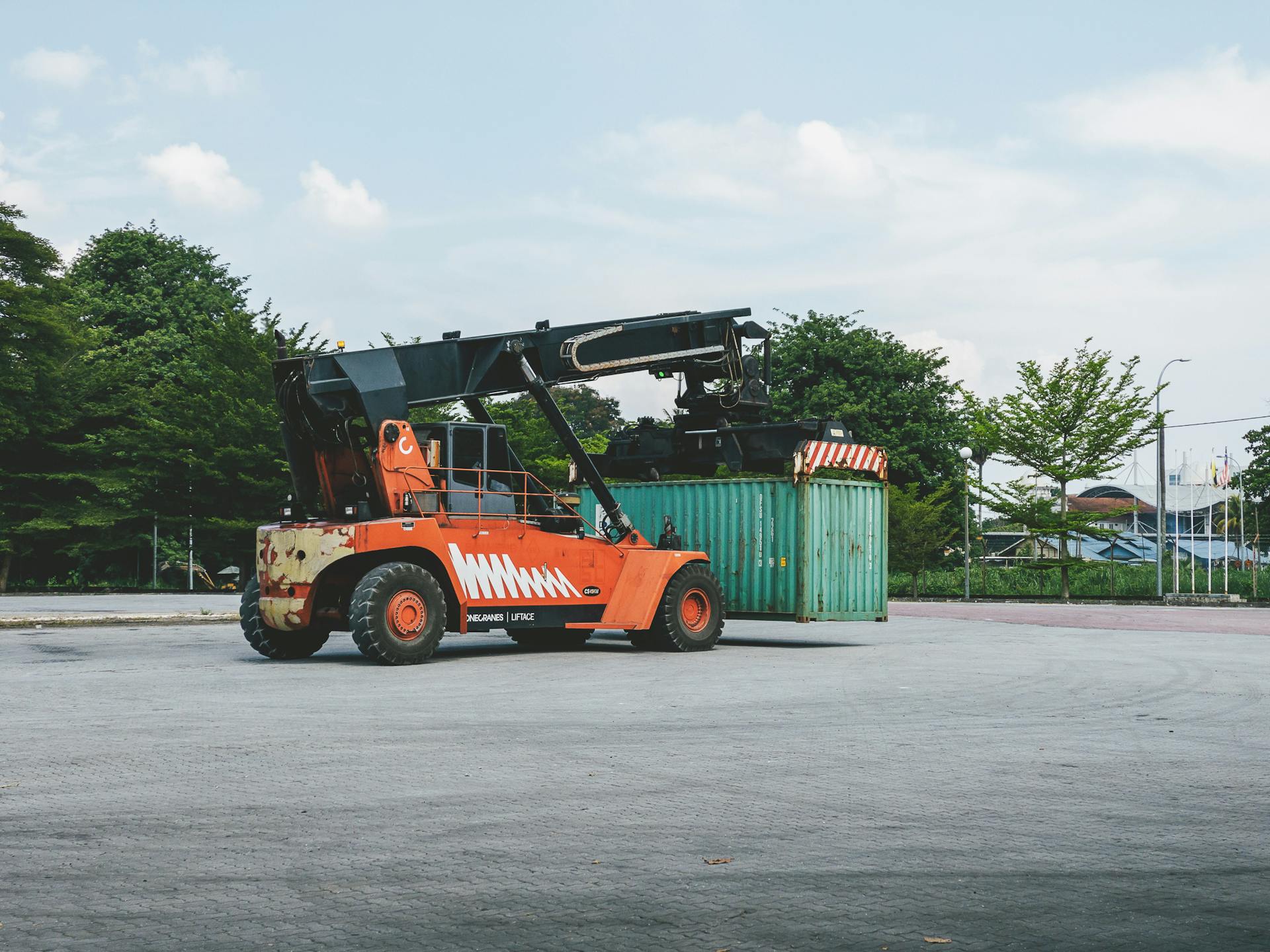 A Container Handler next to a Container