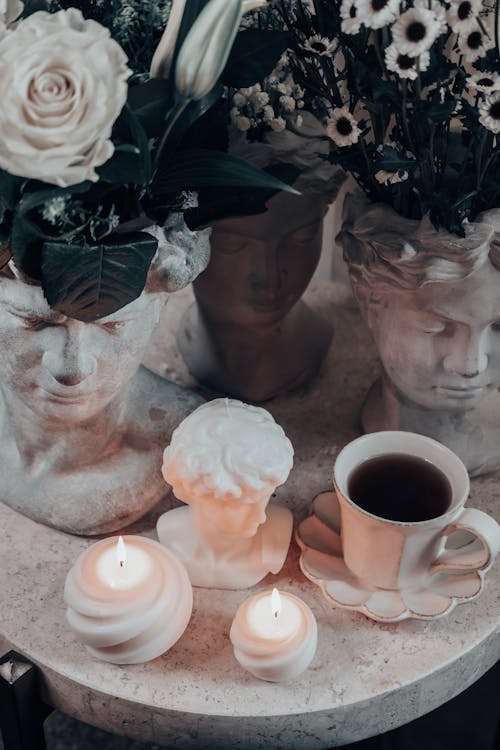 A Cup of Tea, Candles and Flowers in Pots