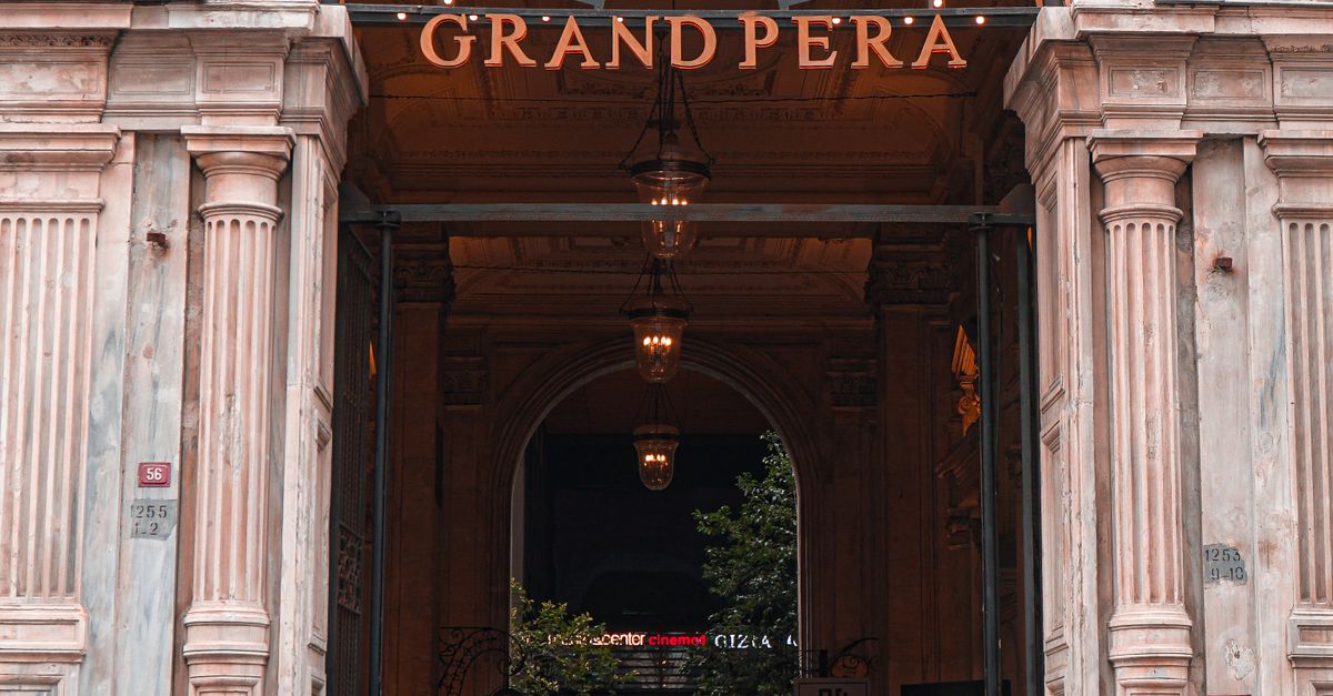 Pera Building Pedestrians Passing by the Entrance to the Grand Pera Building in ...