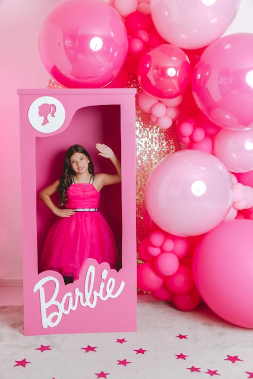 Free Girl Posing as a Barbie Doll Stock Photo