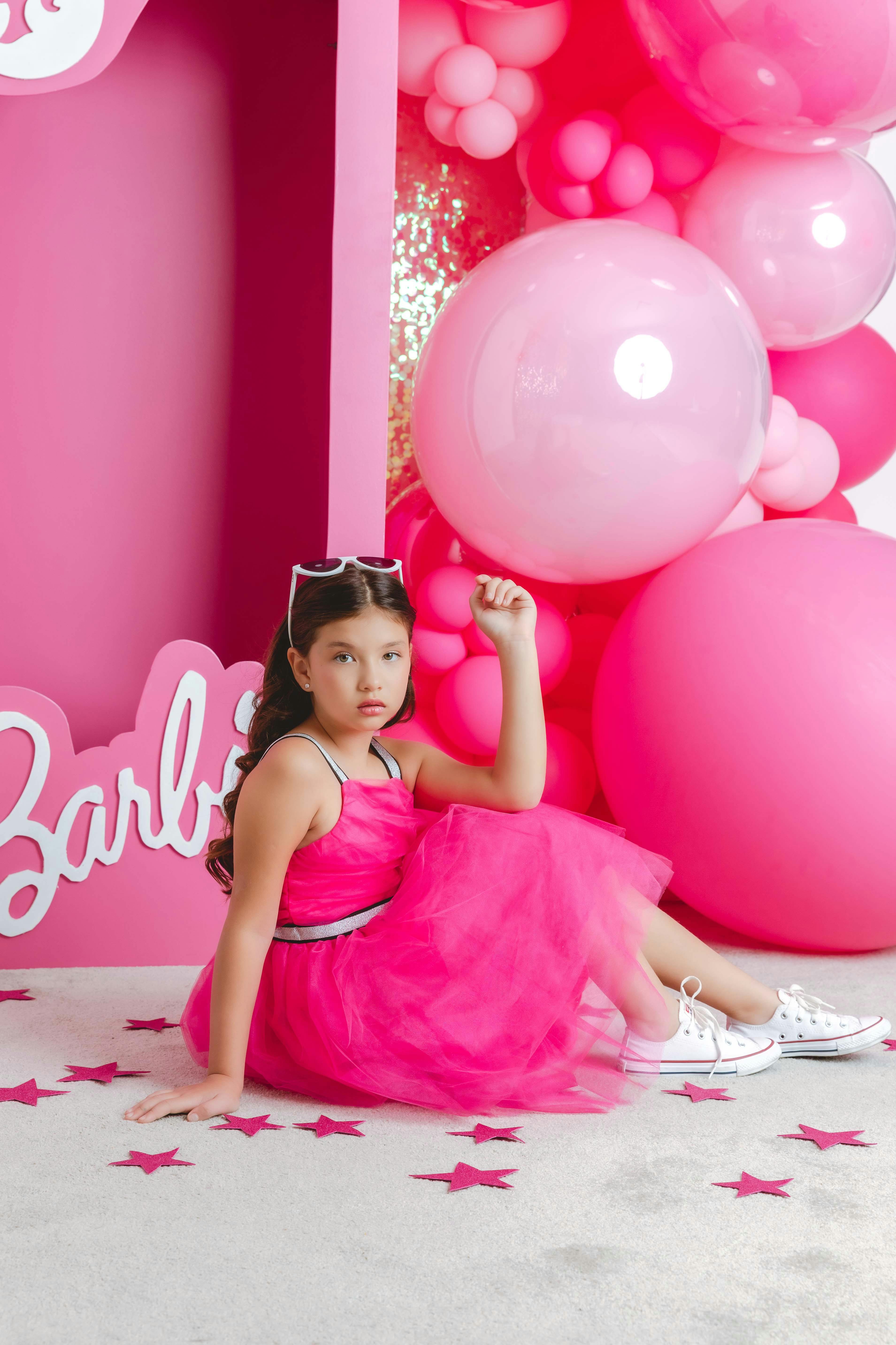 free photo of girl in a pink dress posing as barbie