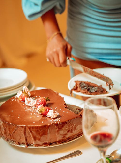 Woman Cutting Chocolate Cake