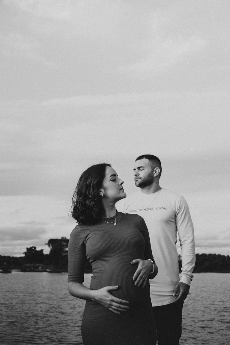 Couple Standing At The Lake