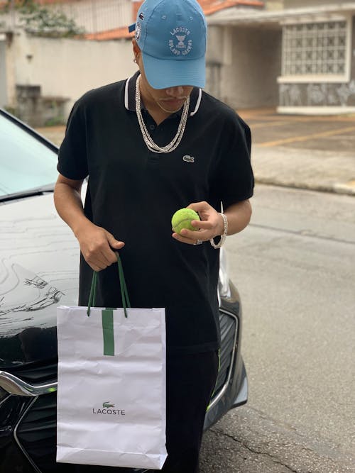 Free Man Standing with Bag and Tennis Balls Stock Photo