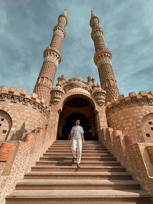 Man on Stairs of Mosque in Cairo