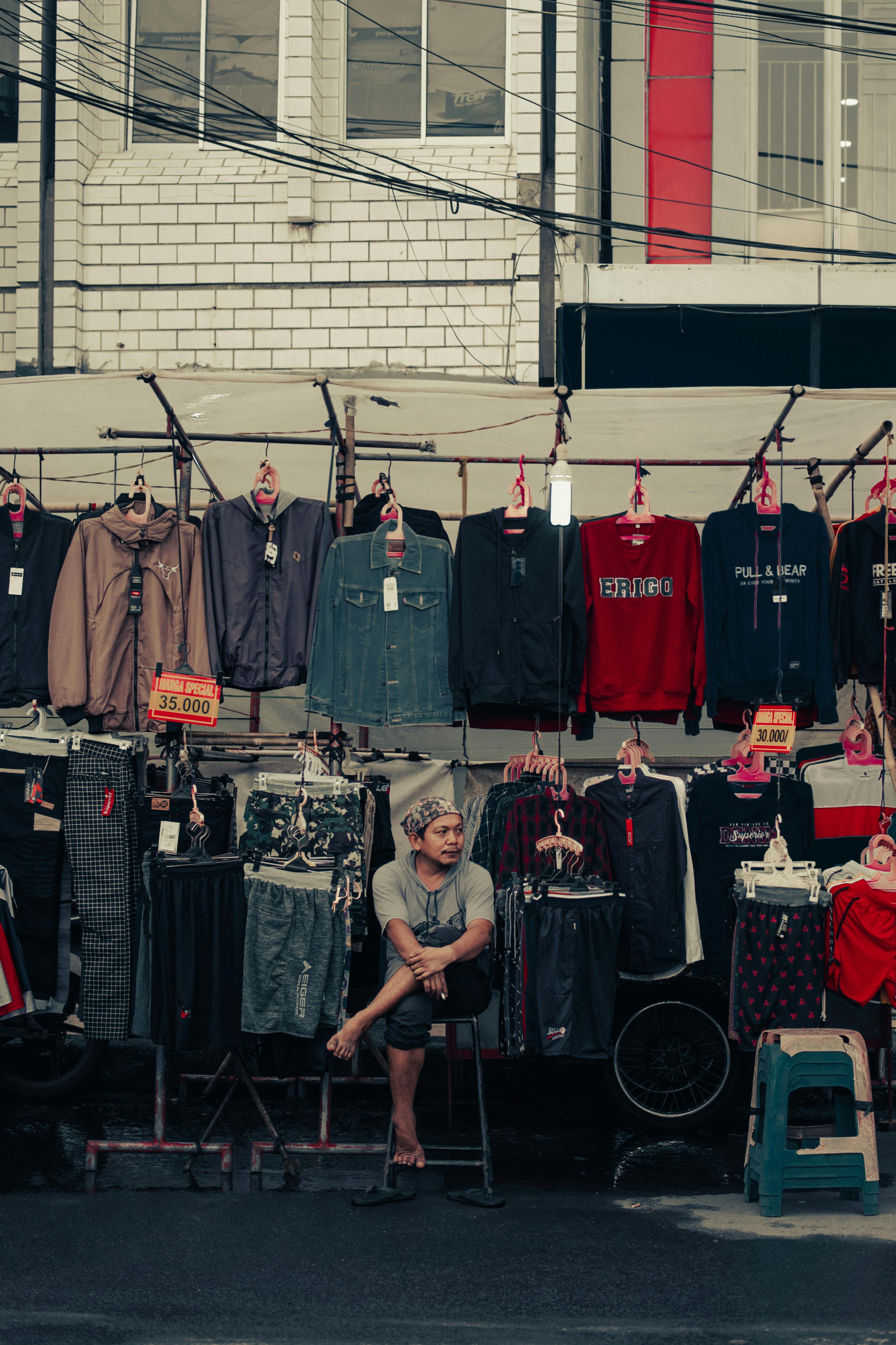 Clothes Seller on Street Market · Free Stock Photo
