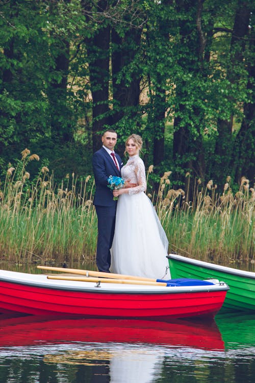 Newlyweds Posing Together on Lakeshore