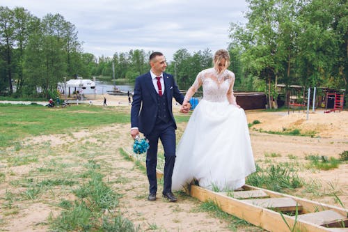 Newlyweds Walking and Holding Hands