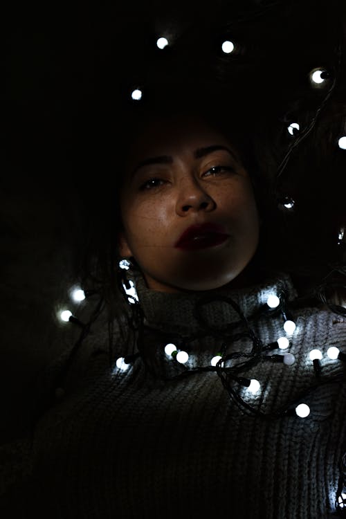 Photo of Woman Wearing Knitted Sweater