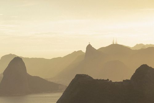 Free Stunning silhouette of Rio's mountains at dawn, featuring misty hues and serene landscapes. Stock Photo
