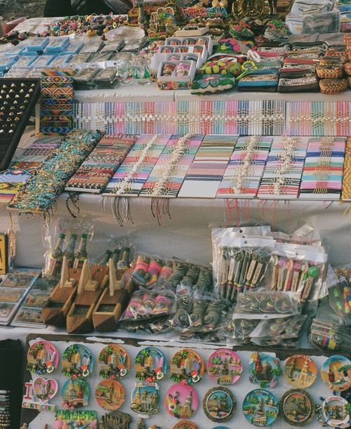 Free Vibrant display of souvenirs and crafts at a market in Cartagena, Colombia. Stock Photo