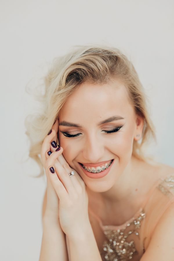 Smiling woman wearing dental braces