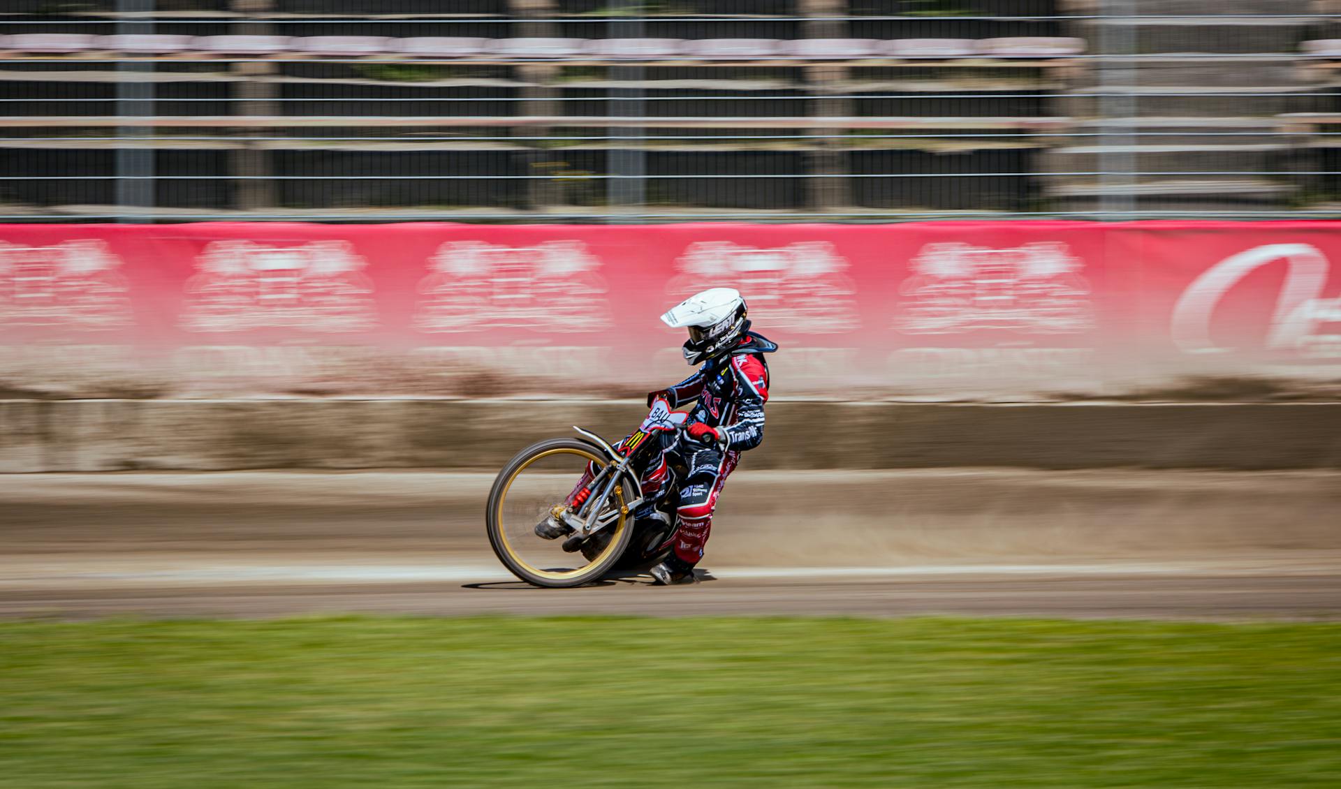 A person riding a motorcycle on a dirt track