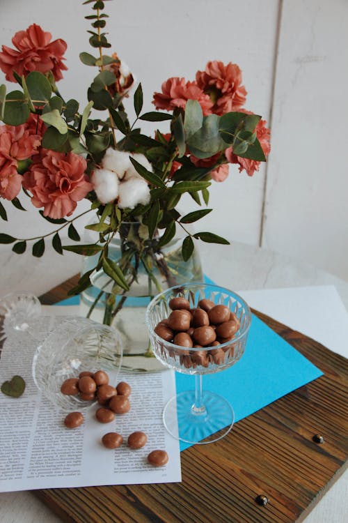 Nuts by Flowers in Vase