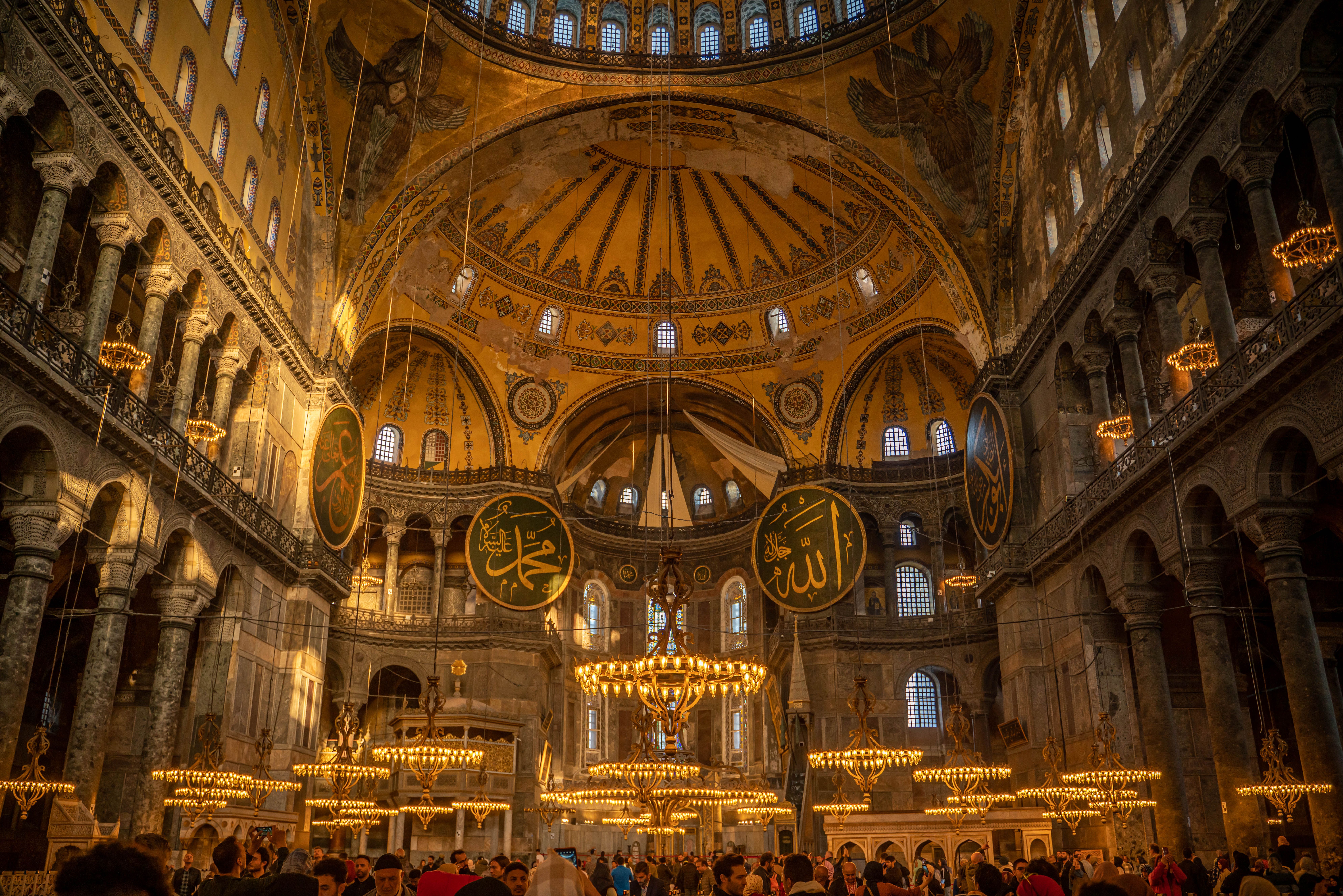 A breathtaking view inside Hagia Sophia, showcasing its intricate Byzantine architecture and golden domes.