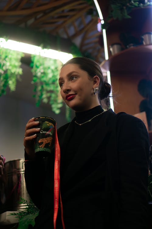 Free Young Brunette Woman with Cup in Hand Stock Photo