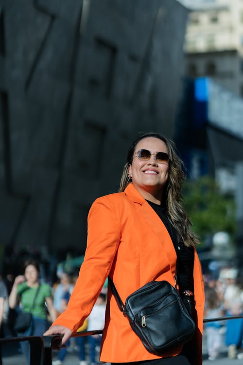 Smiling Woman in an Orange Jacket