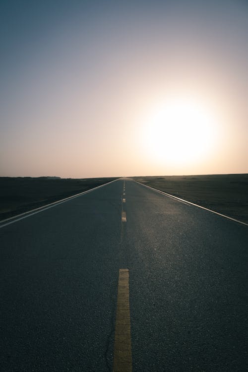 Sun over Empty Road at Sunset