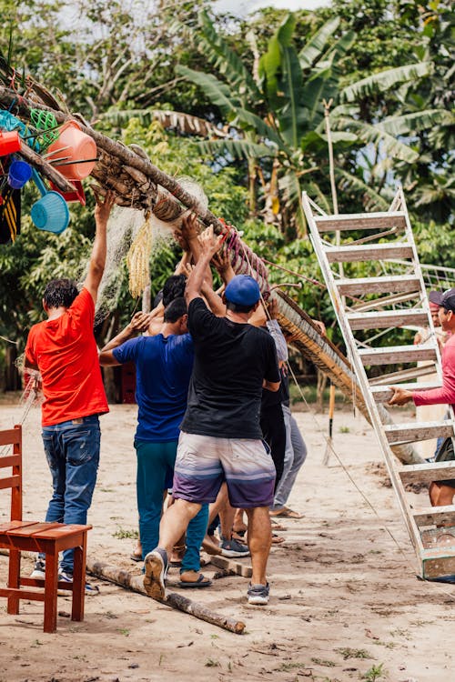 Group of People Making an Installation on a Beach