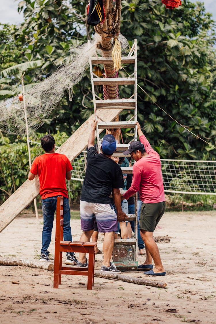 Group Of People Making An Installation On A Beach