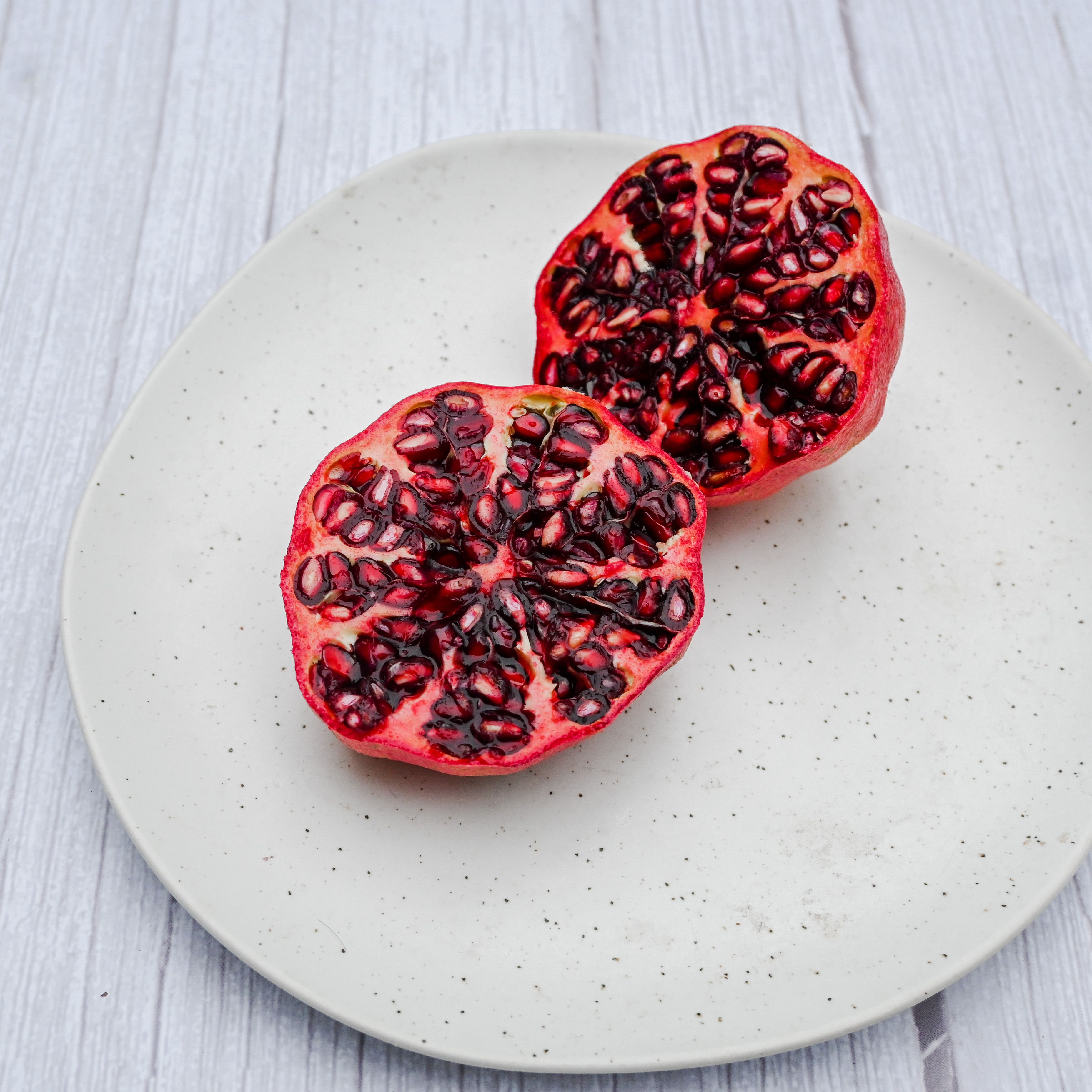 Pomegranate Fruit Cut in Half · Free Stock Photo