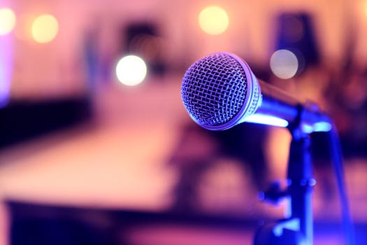 Focused image of a microphone on stage, perfect for events or performances.