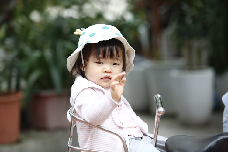 Girl Greeting By Waving Hand